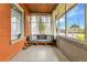Charming sunroom with ample natural light, neutral furniture, and calming aesthetic at 2096 S Logan St, Denver, CO 80210