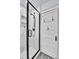 Shower features a marble tile surround and frameless glass door, creating a luxurious feel at 2096 S Logan St, Denver, CO 80210