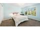 Light and airy bedroom with ample natural light and carpet at 5594 S Jasper Way, Centennial, CO 80015