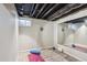 Basement with gym space featuring modern flooring, paint, mirror and workout equipment at 7866 S Valentia Way, Centennial, CO 80112