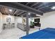 Finished basement featuring living and rec areas, with painted ceilings and modern decor at 7866 S Valentia Way, Centennial, CO 80112
