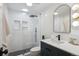 Modern bathroom offers a glass shower, stylish vanity and modern fixtures at 7866 S Valentia Way, Centennial, CO 80112
