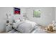 Charming bedroom with neutral decor features light grey walls and cozy bedding at 7866 S Valentia Way, Centennial, CO 80112
