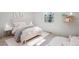 Bedroom with a stylish pink bed, white walls, and delicate decor accents at 7866 S Valentia Way, Centennial, CO 80112