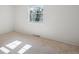 Bright bedroom with plush carpeting and a window showcasing the outdoor light at 7866 S Valentia Way, Centennial, CO 80112