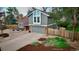 Well-maintained home with brick accents, a landscaped yard, and an attached two-car garage at 7866 S Valentia Way, Centennial, CO 80112