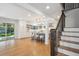 Spacious kitchen featuring a large island, stainless steel appliances, and hardwood floors at 7866 S Valentia Way, Centennial, CO 80112