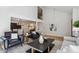 Bright and open living room with a fireplace and seamless flow into the dining area at 7866 S Valentia Way, Centennial, CO 80112