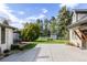 Spacious backyard with lush lawn, mature trees, patio, and shed offers a serene outdoor retreat at 3540 Everett St, Wheat Ridge, CO 80033