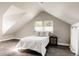 Bedroom with wood floor, light walls, and a window that lets in natural light at 3540 Everett St, Wheat Ridge, CO 80033