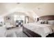 Bright bedroom with a large bed, wood floors, and natural light from the window at 3540 Everett St, Wheat Ridge, CO 80033