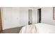 Bedroom featuring large sliding door closet and bright natural light at 3540 Everett St, Wheat Ridge, CO 80033