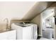 Well-equipped laundry room with modern washer and dryer and convenient sink at 3540 Everett St, Wheat Ridge, CO 80033