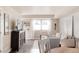 Inviting living space with wood floors, tv, comfortable seating, and plenty of natural light at 3540 Everett St, Wheat Ridge, CO 80033