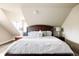Cozy bedroom featuring plush bedding, decorative pillows, and bedside lamps at 3540 Everett St, Wheat Ridge, CO 80033