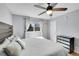 A cozy bedroom features a modern ceiling fan and a dark wood accent headboard at 11278 W 103Rd Dr, Broomfield, CO 80021