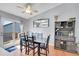 Bright and spacious dining area featuring wood floors and adjacent access to the outdoor deck at 11278 W 103Rd Dr, Broomfield, CO 80021