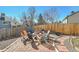 Backyard seating area with a firepit and mature trees at 11278 W 103Rd Dr, Broomfield, CO 80021