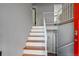 Bright, updated staircase with wood treads and white risers in a well-maintained home at 11278 W 103Rd Dr, Broomfield, CO 80021