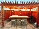 Outdoor patio featuring pergola, stone bar, and built in grill at 1322 Kalamath St, Denver, CO 80204