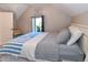 Bedroom featuring a blue and white blanket on the bed with a ceiling fan, and a window at 1322 N Kalamath St, Denver, CO 80204