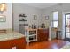 Kitchen area featuring granite countertops, floating shelves, stainless steel appliances, and hardwood floors at 1322 Kalamath St, Denver, CO 80204