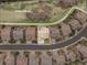Aerial view of the home with its lot boundaries, adjacent open space, and neighborhood streets at 5010 Persimmon Ln, Castle Rock, CO 80109