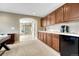 Convenient wet bar area with wine and coffee bar between office and main bathroom at 5010 Persimmon Ln, Castle Rock, CO 80109