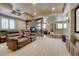 Finished basement with a stone fireplace, leather recliners, and a bar for entertaining at 5010 Persimmon Ln, Castle Rock, CO 80109
