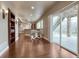 Finished basement with a walkout patio, wooden floors, a wet bar, and a serving area at 5010 Persimmon Ln, Castle Rock, CO 80109