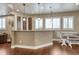 Basement bar with granite countertops, a seating area, pendant lights, and plenty of natural light at 5010 Persimmon Ln, Castle Rock, CO 80109