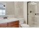 Modern bathroom featuring vanity, toilet and walk-in shower with glass door at 5010 Persimmon Ln, Castle Rock, CO 80109