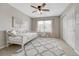 Bedroom with daybed, a grey patterned rug, and view of the front yard at 5010 Persimmon Ln, Castle Rock, CO 80109