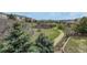 Scenic community view with a walking path and lush green space at 5010 Persimmon Ln, Castle Rock, CO 80109