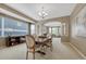 Elegant dining room with a large window, chandelier and open access to other living spaces at 5010 Persimmon Ln, Castle Rock, CO 80109