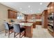 Spacious kitchen featuring two islands, stainless steel appliances, tile floors, and plenty of counter space at 5010 Persimmon Ln, Castle Rock, CO 80109
