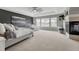 Spacious main bedroom featuring a fireplace, ceiling fan, and lots of natural light at 5010 Persimmon Ln, Castle Rock, CO 80109