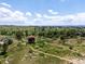 Picturesque aerial view of a vast grassy area with walking trails and a scenic gazebo at 11945 S Saunter Ln, Parker, CO 80138