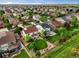 Aerial view of a residential neighborhood with well-manicured lawns and mature trees at 11945 S Saunter Ln, Parker, CO 80138