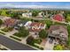 Scenic aerial view of a neighborhood showcasing well-manicured lawns and diverse home styles at 11945 S Saunter Ln, Parker, CO 80138