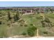 Beautiful neighborhood aerial view showcasing community pool and landscaping at 11945 S Saunter Ln, Parker, CO 80138