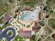 Aerial view of the community pool area with lounge chairs and well manicured grounds at 11945 S Saunter Ln, Parker, CO 80138