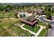 Scenic aerial view of a community amenity center featuring pools, a clubhouse, and well-kept landscaping at 11945 S Saunter Ln, Parker, CO 80138