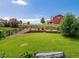 Expansive backyard featuring lush green grass, landscaping, and a fence at 11945 S Saunter Ln, Parker, CO 80138