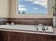 Close up of soaking tub with upgraded faucet and tile details at 11945 S Saunter Ln, Parker, CO 80138