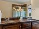 Bathroom featuring a double vanity with granite countertops at 11945 S Saunter Ln, Parker, CO 80138