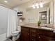 Clean bathroom with decorative vanity, shower, and toilet at 11945 S Saunter Ln, Parker, CO 80138