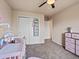 Bright bedroom with closet and ceiling fan at 11945 S Saunter Ln, Parker, CO 80138