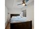 Neutral bedroom with ceiling fan and natural light from window at 11945 S Saunter Ln, Parker, CO 80138