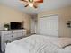 Bedroom with fan, bright window, and ample closet space at 11945 S Saunter Ln, Parker, CO 80138